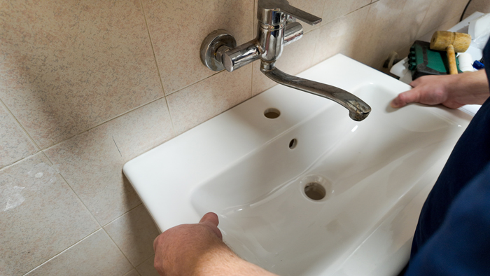 The Drain Man technician performing emergency plumbing repair in Knoxville, TN