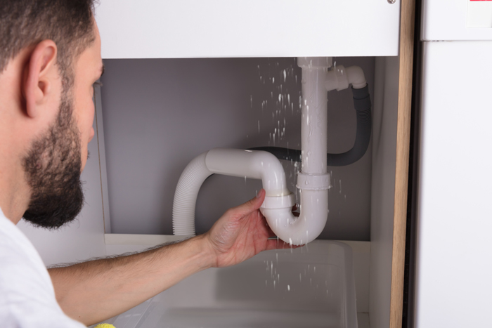 The Drain Man technician performing emergency plumbing repair in New Market, TN