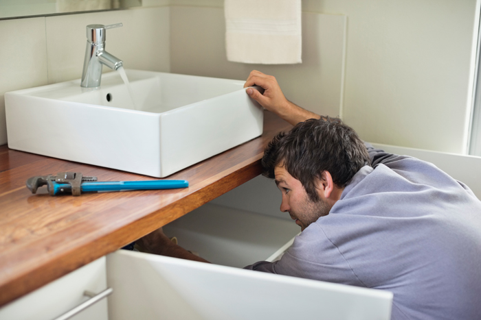 The Drain Man technician performing emergency plumbing repair in Farragut, TN